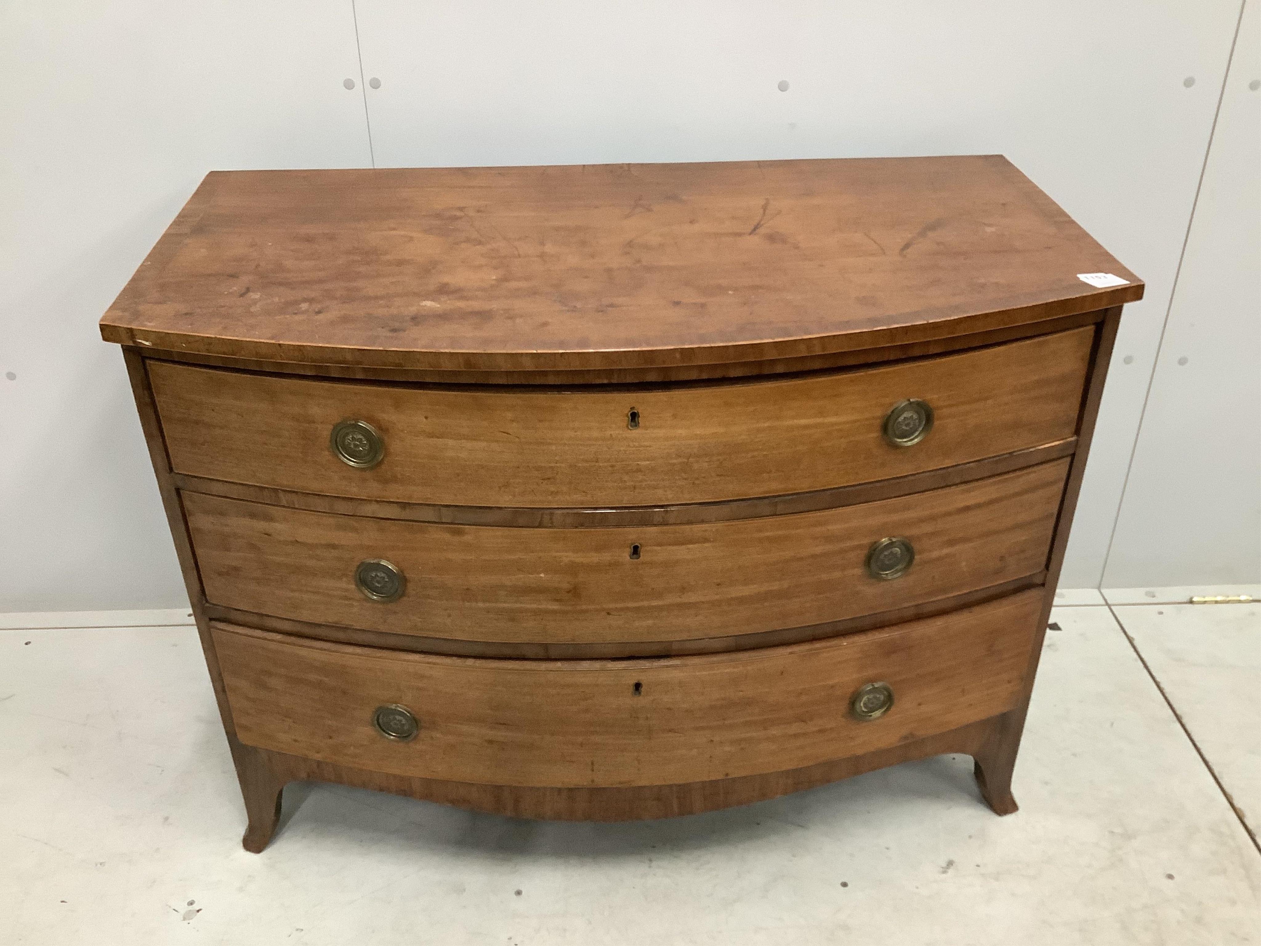 A Regency mahogany bow fronted chest of three drawers, width 109cm, depth 58cm, height 81cm. Condition - poor to fair, top badly marked